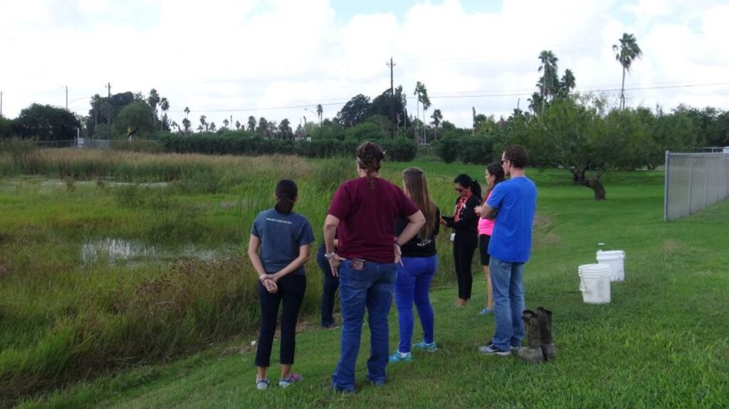 Los Fresnos students collecting water samples as part of the Texas Stream Team Training.