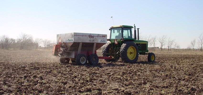 Tractor harvesting a field