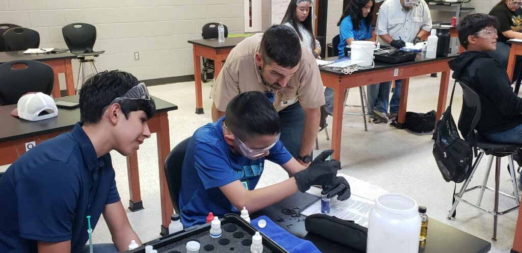 Lucas Gregory educates high school students on water quality
